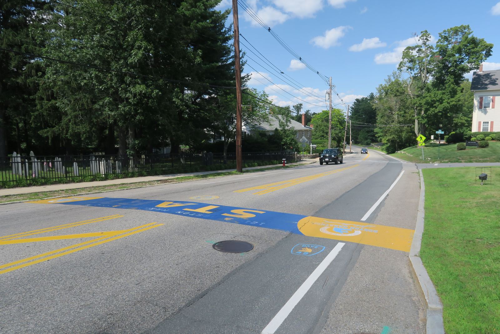 The Boston Marathon starting line painted on the road in Hopkinton, Massachusetts